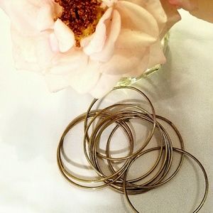 Gold toned interlocking bangle bracelets